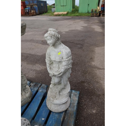 2709 - A concrete statue of a lady holding a dove