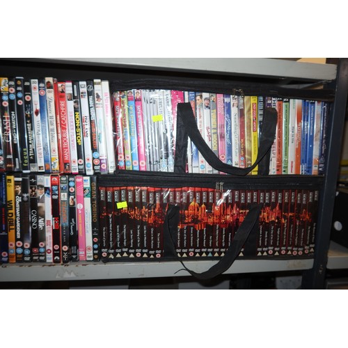 2438 - A large quantity of various DVDs, contents of 2 shelves