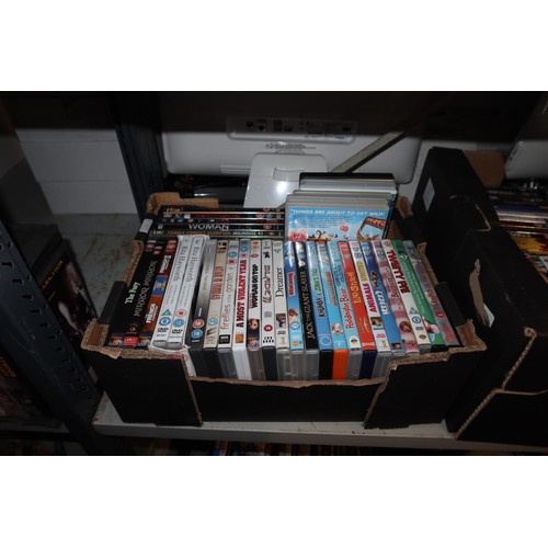 2440 - A quantity of various DVDs, contents of 3 shelves