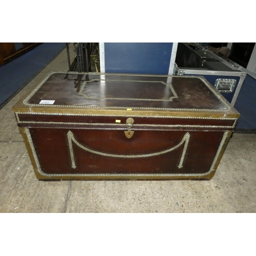 3760 - A vintage brass bound and studded storage trunk with a lift lid and side handles