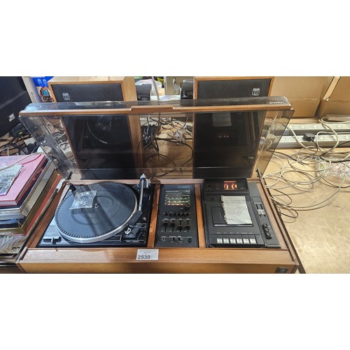 2530 - A vintage stereo system by Dynatron with speakers, tuner cassette recorder, Gerrard 35SB record play... 