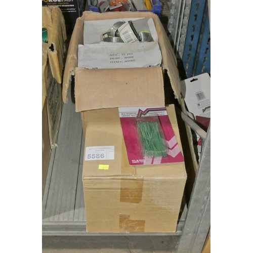 5586 - 1 box containing a quantity of garden ties and 1 box containing a quantity of green garden wire