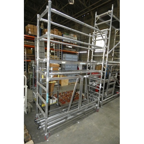 6053 - An aluminium low level klikfold scaffold tower by Euro Towers approx 196 x 72 x 280cm high supplied ... 