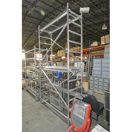 6054 - An aluminium scaffold tower approx 196 x 72 x 470cm high supplied with 3 x platform boards (SWL 250k... 