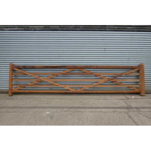 6547 - 1 x wooden (Iroko) gate measuring approx 500cm wide