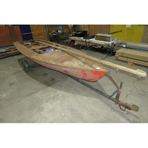 6315 - A plywood built sailing dinghy approx 440cm long x 175cm wide, possibly an International Cadet saili... 