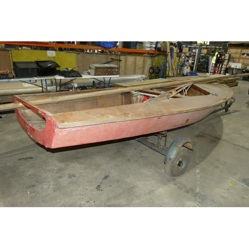 6315 - A plywood built sailing dinghy approx 440cm long x 175cm wide, possibly an International Cadet saili... 