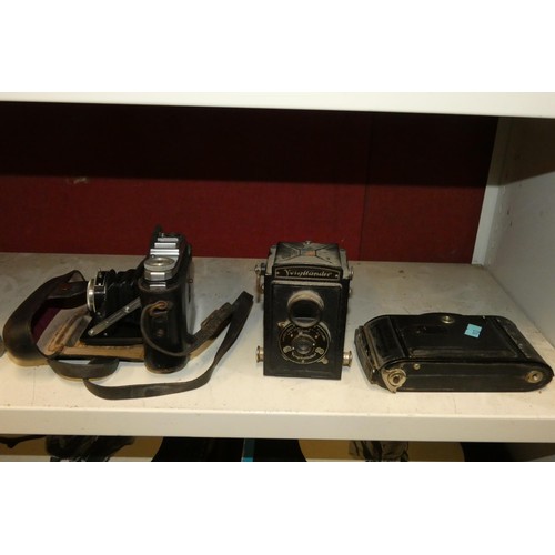 3006 - A collection of miscellaneous bellows cameras, later 1960s cameras and other photographic equipment ... 