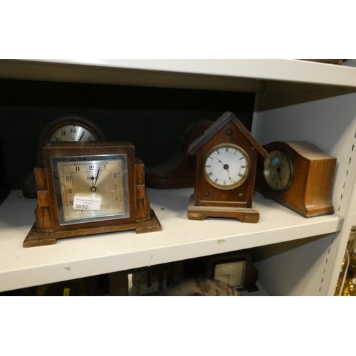 3052 - A quantity of decorative vintage wooden mantle clocks (one shelf)