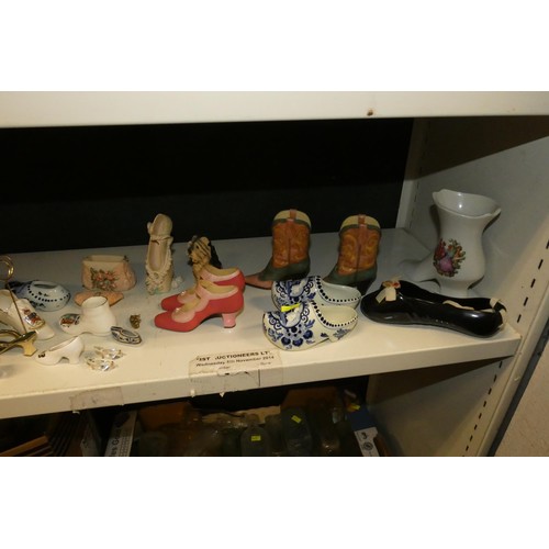 3076 - A large quantity of miscellaneous decorative vintage china shoes and boots (three shelves)