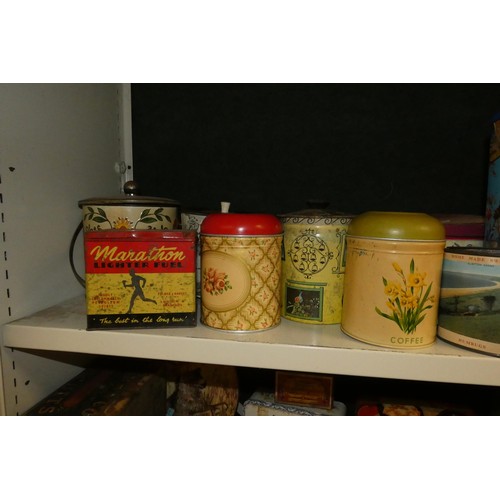 3081 - A large quantity of miscellaneous decorative vintage storage tins and advertising tins (four shelves... 