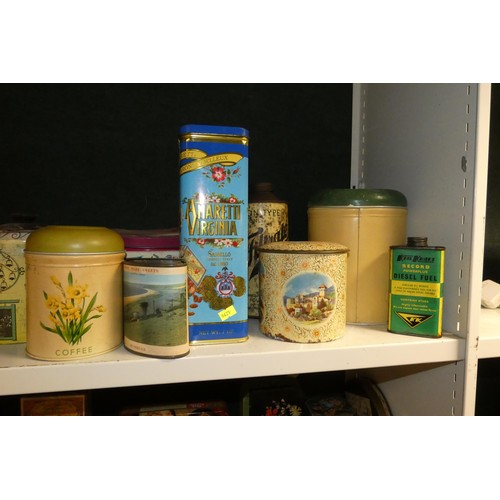 3081 - A large quantity of miscellaneous decorative vintage storage tins and advertising tins (four shelves... 