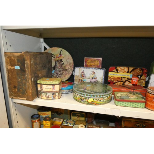 3081 - A large quantity of miscellaneous decorative vintage storage tins and advertising tins (four shelves... 