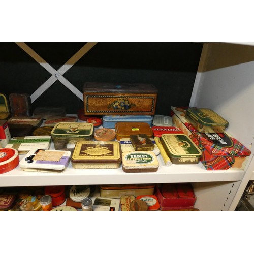 3081 - A large quantity of miscellaneous decorative vintage storage tins and advertising tins (four shelves... 