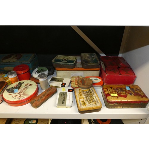 3081 - A large quantity of miscellaneous decorative vintage storage tins and advertising tins (four shelves... 