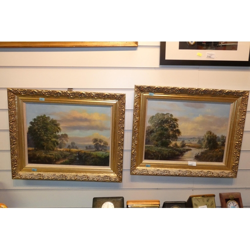 A pair of gilt framed oils on canvas of rural river scenes signed P ...