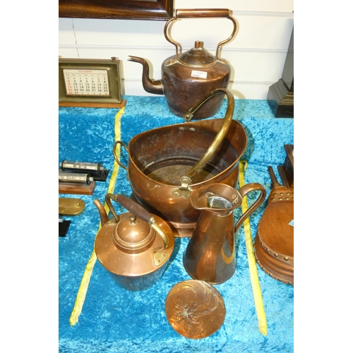 3163 - A copper coal helmet, two copper kettles, a copper conical jug and a small copper dish