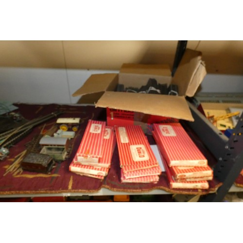 3110 - A quantity of vintage Hornby-Dublo and Meccano model railway track and controllers etc (two shelves)