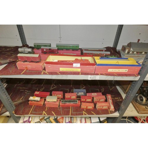 3111 - A quantity of vintage Hornby-Dublo model railway rolling stock, some with boxes (2 shelves)