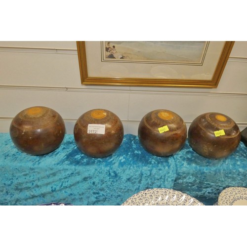 3172 - A set of four of vintage lignum vitae bowling woods