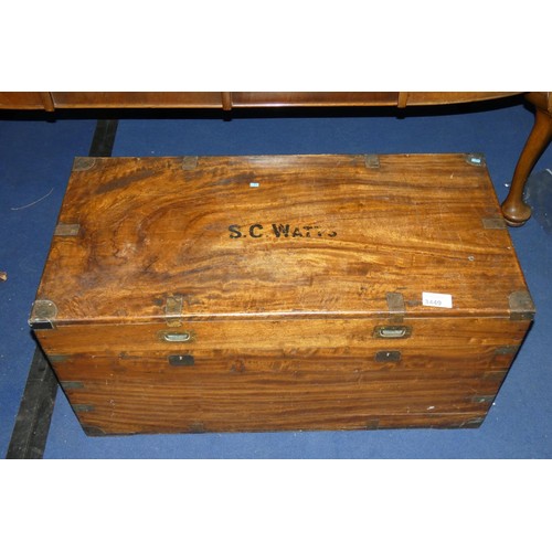 3449 - A large 19th century brass bound hardwood travelling trunk with a lift lid and side handles