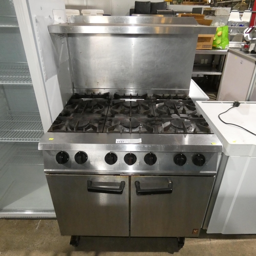 1157 - A commercial stainless steel gas fired 6 burner range by Falcon - Dominator, with steakhouse grill s... 