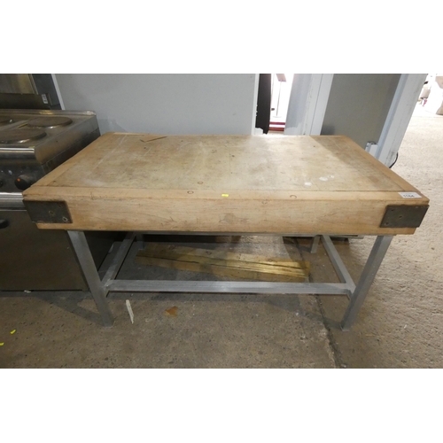 1164 - A large wooden chopping block on a metal frame approx 137x77cm