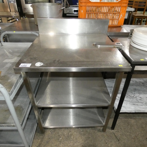 1209 - A commercial stainless steel catering type table witH 2 shelves beneath and industrial tin opening b... 