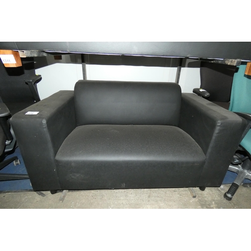 1312 - 1 x black upholstered two person reception type sofa with wooden feet, approx 150cm wide