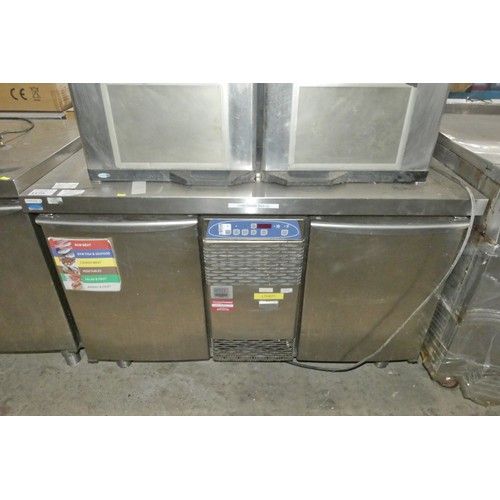 1173 - A commercial stainless steel 2 door under counter bench fridge by Electrolux. Tested Working