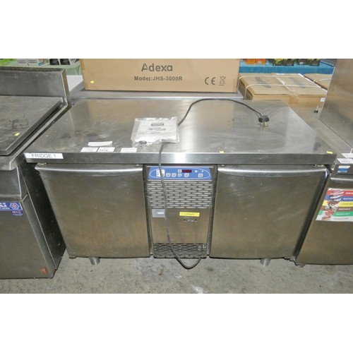 1174 - A commercial stainless steel 2 door under counter bench fridge by Electrolux. Tested Working