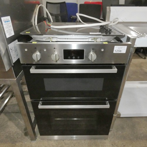 1256 - An integrated 2 door electric oven by Indesit type IDD6340-IX and an integrated hob by Philips -  tr... 