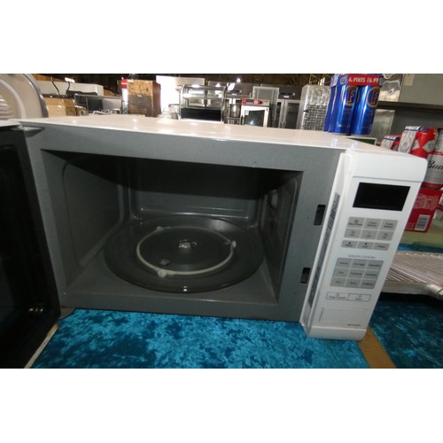 1062 - A microwave oven by Panasonic type NN-ST452W 900W - trade  TESTED WORKING