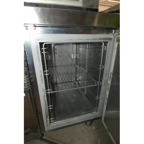 1173 - A commercial stainless steel 2 door under counter bench fridge by Electrolux. Tested Working