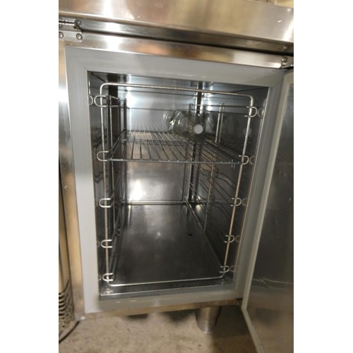 1174 - A commercial stainless steel 2 door under counter bench fridge by Electrolux. Tested Working