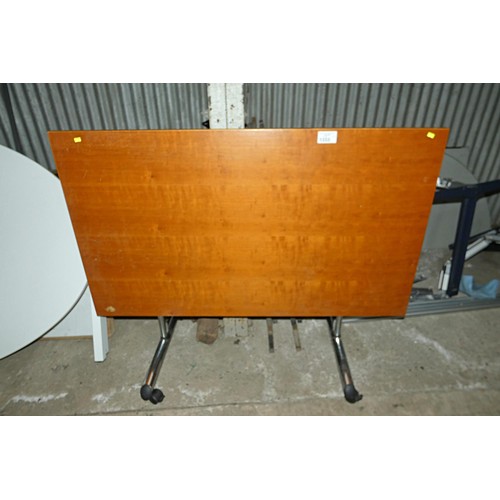 1333 - 1 x wood effect tipping top wheeled table approx 140 x 80cm