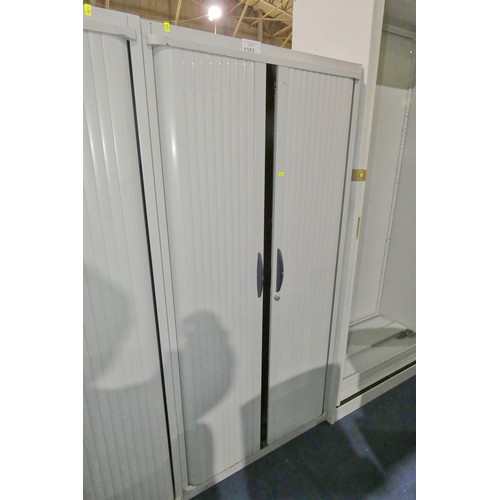 1352 - 1 x grey metal tambour front cabinet approx 80 x 43 x 170cm high. Please note that the top is rusty