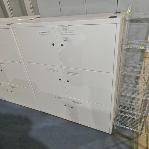 1407 - 1 x white metal 6 door storage cabinet approx 100 x 47 x 120cm high supplied with 6 x keys