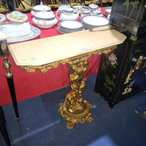 3426 - A gilded cherub console table with marble top