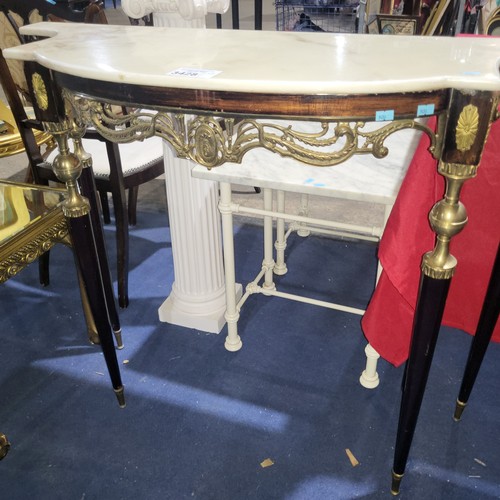 3428 - A marble topped console table with brass accents