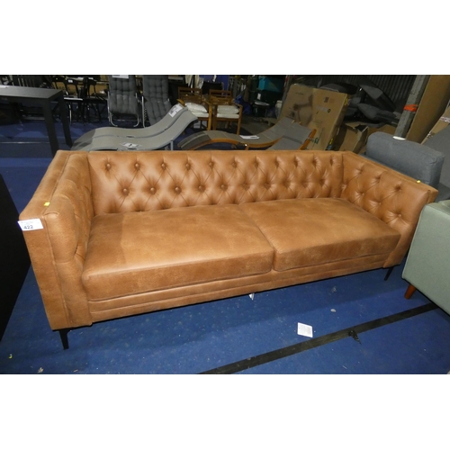 422 - A light brown upholstered button back three person sofa approx 210cm wide