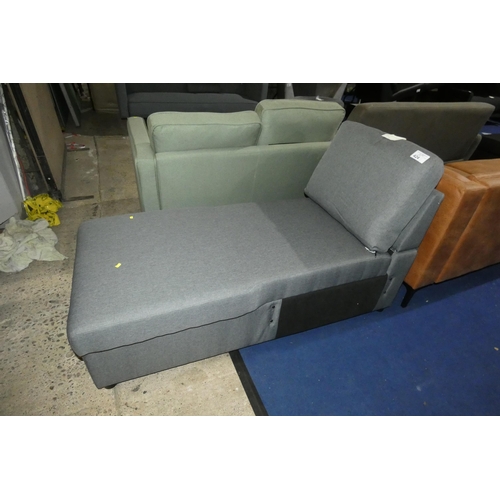 424 - A grey upholstered Ottoman type hinged top storage chaise longue. Please note that no arms are inclu... 