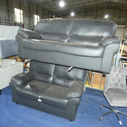 439 - 2 x black upholstered sofas. Please note that the two seater sofa has a tear in the upholstery (just... 