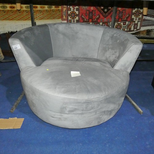 428 - A light grey upholstered swivelling round cuddle chair