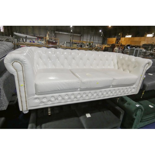 431 - A white upholstered Chesterfield style button back three person sofa approx 190cm wide