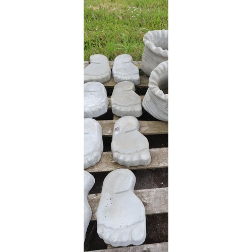 2380 - 4 x concrete foot shaped stepping stones