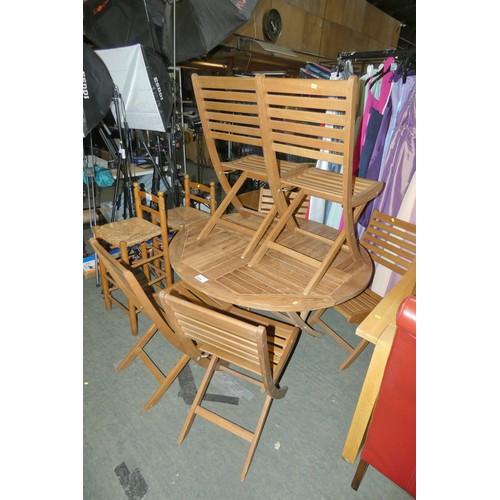 2226 - A tropical hardwood round garden table diameter approx 120cm and 6 x tropical hardwood garden chairs