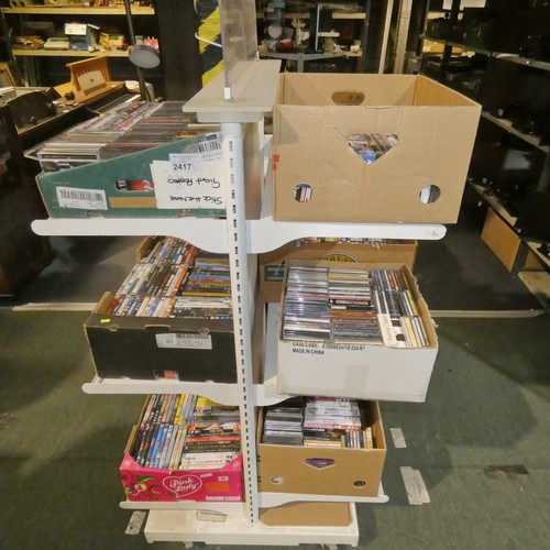 2417 - 7 boxes containing a quantity of various DVDs and CDs, contents of 6 shelves