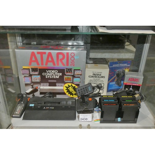 2430 - A vintage boxed Atari 2600 video game console with 6 games and controllers, please see pictures for ... 