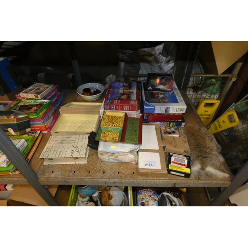 2124 - A quantity of various household items including jigsaws, crockery, a clock, a iron 240v etc. Content... 